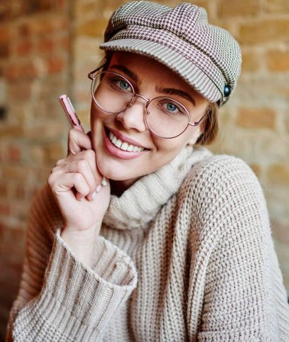 cheerful-female-in-room-with-brick-wall-2023-11-27-04-59-14-utc_11zon.jpeg